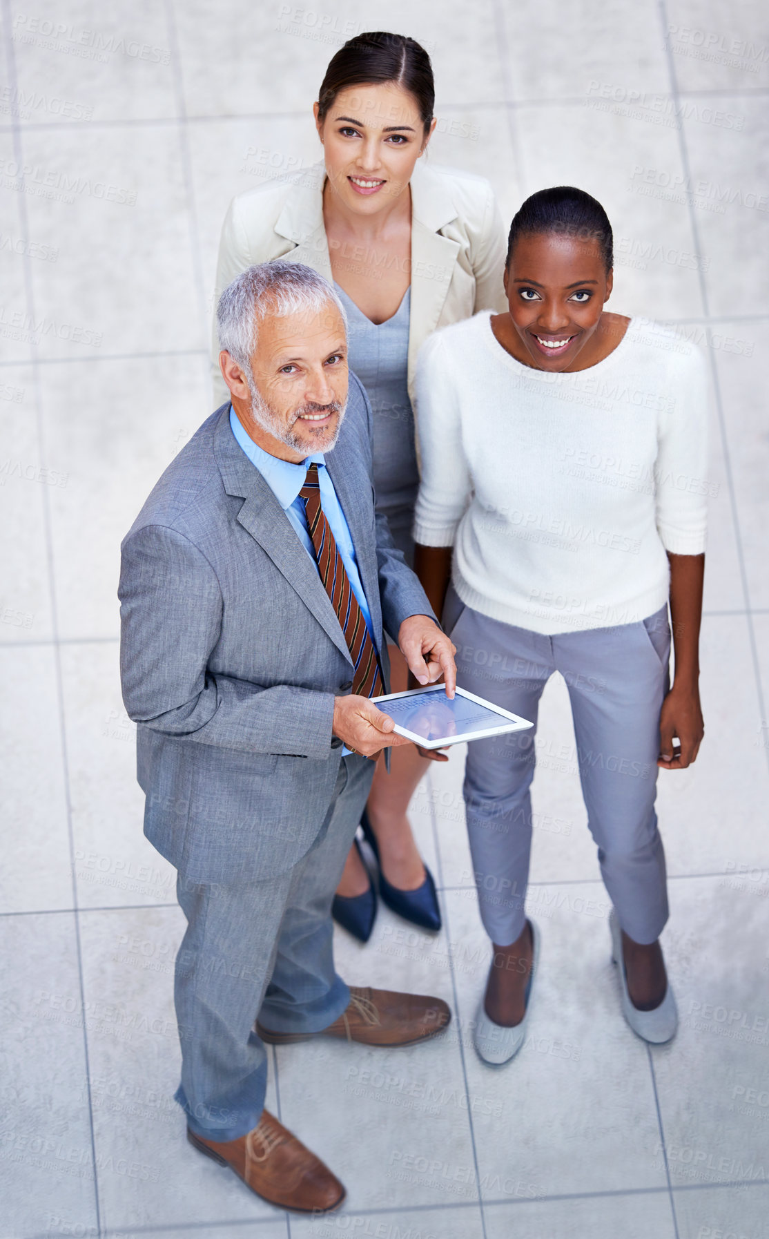 Buy stock photo Portrait, tablet and business people in discussion in lobby of office in collaboration for research. Smile, digital technology and high angle of professional finance advisors in meeting in workplace.