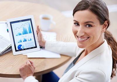 Buy stock photo Cropped shot of a young businesswoman at work. All screen content is designed by us and not copyrighted by others, and upon purchase a user license is granted to the purchaser. A property release can be obtained if needed.