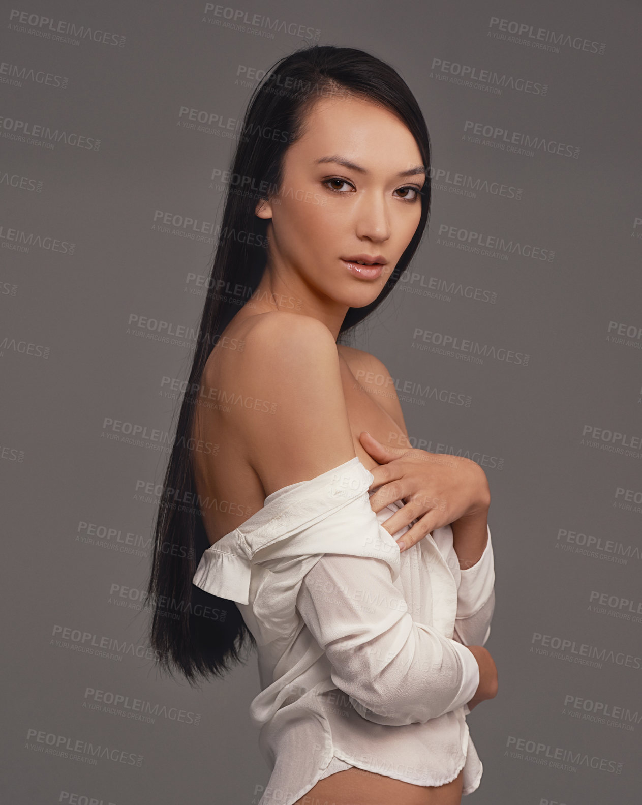 Buy stock photo Portrait, shirt and beauty with woman, fashion and confident girl on a grey studio background. Face, person and model with stylish lingerie and mockup space with pride, aesthetic and casual outfit