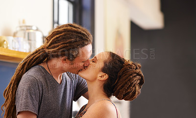 Buy stock photo Kitchen, kiss and couple in home for love, bonding relationship and commitment together. Dating, happy and Rasta man and woman embrace for affection in house for marriage, romance and happiness