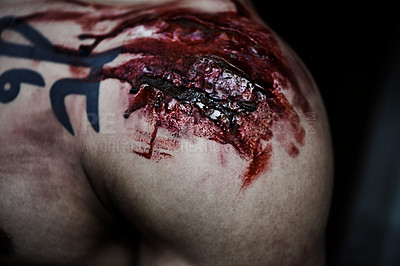 Buy stock photo A cropped shot of a man with a serious wound on his shoulder