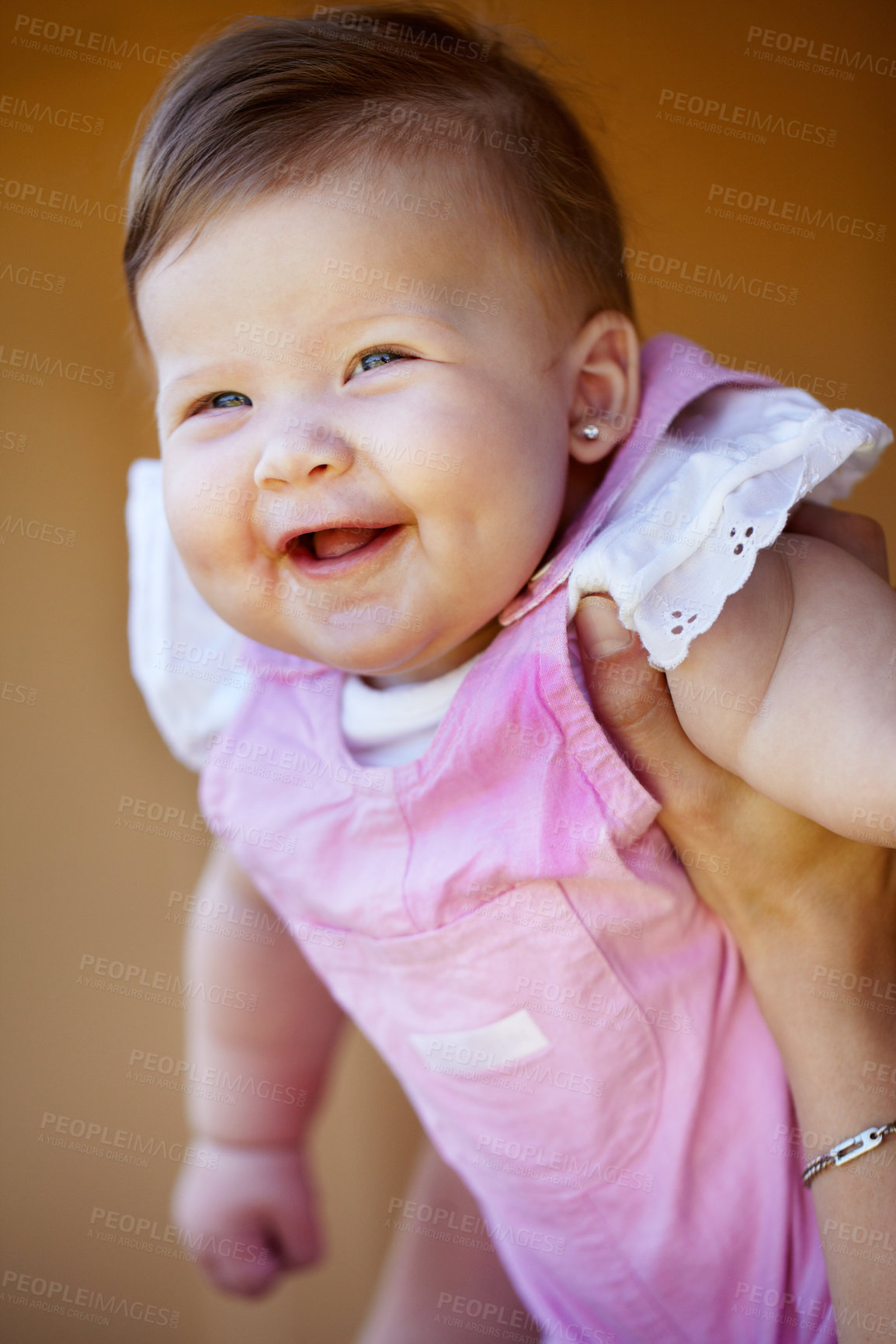 Buy stock photo Hands, holding and portrait of a baby for playing, laughing and bonding with a parent in a house. Happy, playful and a infnt, child or girl kid in the arms of a mother for trust, care and fun