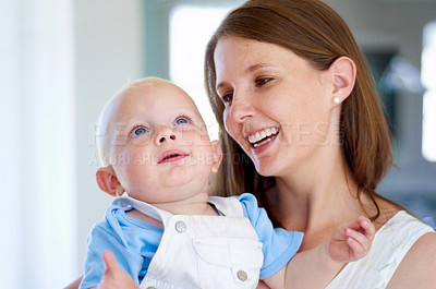 Buy stock photo Happy, hug or mother with newborn or baby for love or bond together to nurture child development. Smile, face or single parent mom with infant for trust, growth or safety in family house to relax