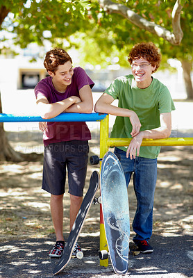 Buy stock photo Teenager boy, friends and happy with skateboard in park for summer, vacation and relax by trees. Gen z people, skater and smile at playground for outdoor sport with social conversation in Vancouver
