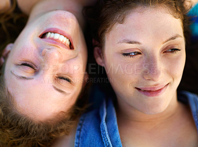 Buy stock photo Shot of two teenage sisters hanging out together