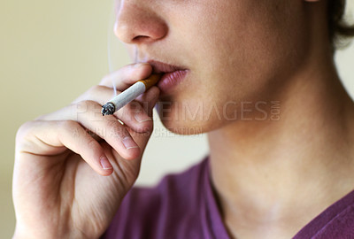 Buy stock photo Closeup of a person taking a drag from a cigarette