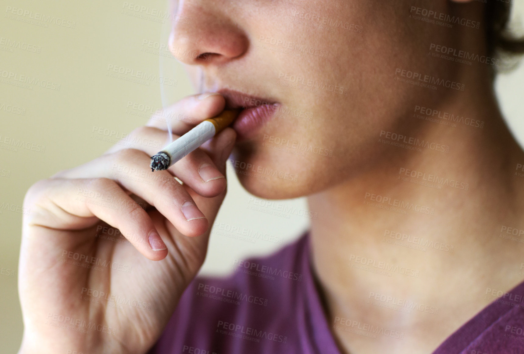 Buy stock photo Closeup of a person taking a drag from a cigarette