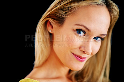 Buy stock photo Closeup studio portrait of a beautiful young blonde woman on a black background