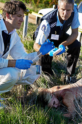 Buy stock photo A shot of forensics working at a crime scene