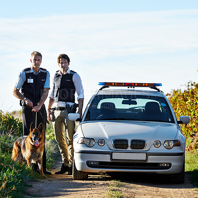 Buy stock photo Policeman, dog and car in field to search at crime scene or robbery for safety, law enforcement and evidence. Detective, investigation and uniform in outdoor working at countryside with gravel road