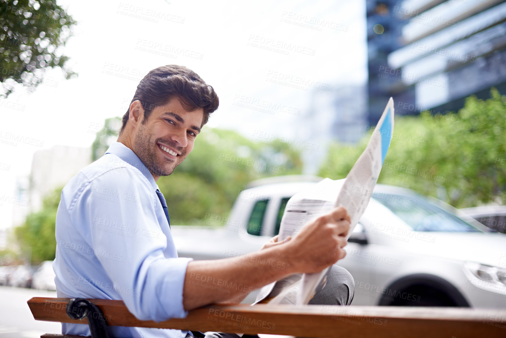 Buy stock photo Portrait, businessman and reading newspaper for information, daily news and updates on local events. Professional, male person and outdoor with smile for knowledge, stories and article in city