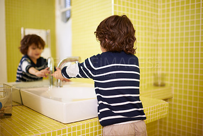 Buy stock photo Boy, bathroom and hands with washing, hygiene and cleaning with mirror at home. Child, faucet and reflection for healthy, development and childhood with morning routine at home for cleanliness
