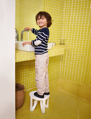 Buy stock photo Little boy, portrait and tap with water for washing, hygiene or cleanliness in bathroom at home. Face of male person, child or young kid with smile for hand wash or cleaning in sink at the house