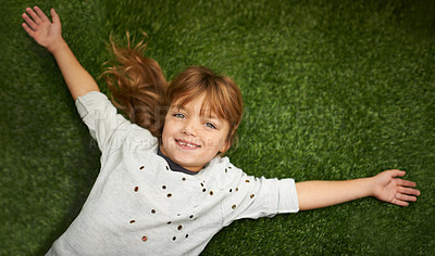 Buy stock photo Child, relax and happy in portrait on grass for freedom, vacation and outdoor wellness in nature. High angle or above of a young kid or girl with open arms on lawn and excited face in park and spring