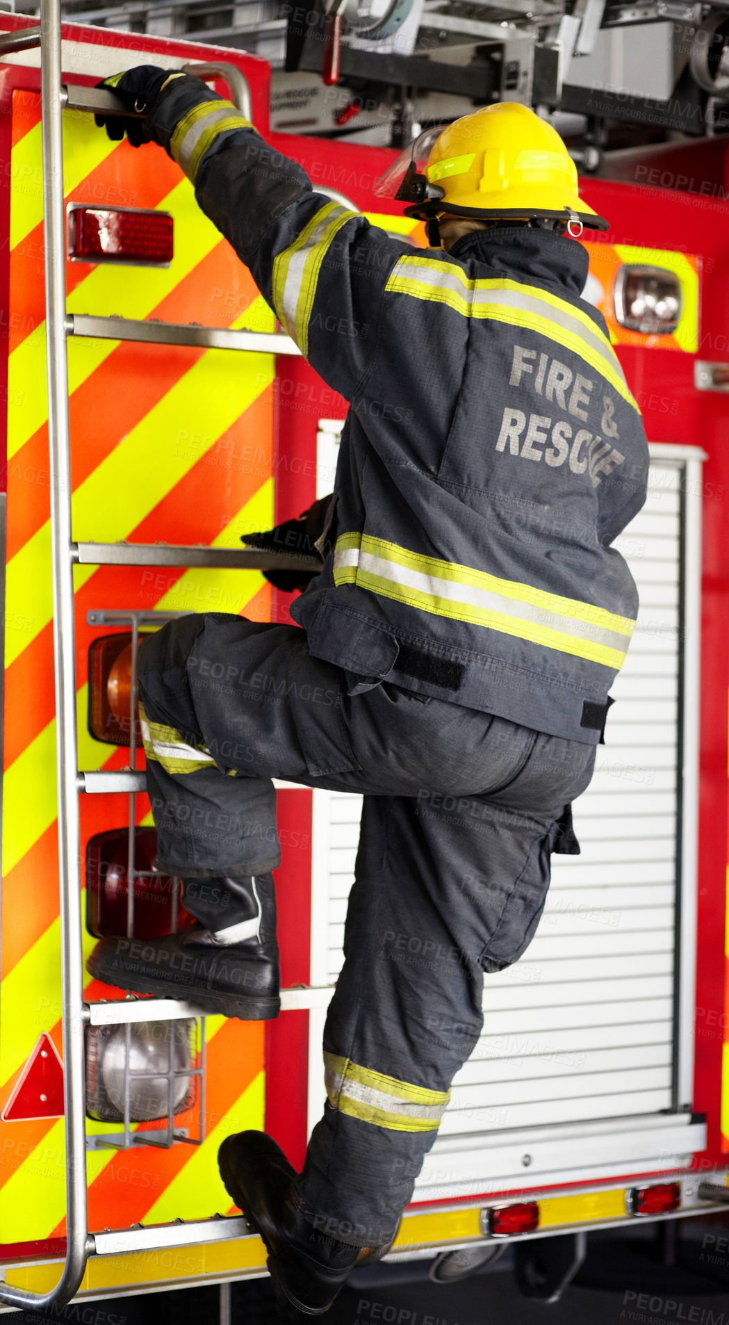 Buy stock photo Firefighter, man and climbing ladder for emergency operation, service or rescue with equipment. Fireman person with helmet, jacket and gear protection getting on truck for firefighting at station