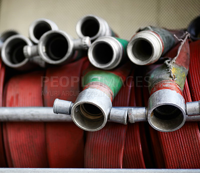 Buy stock photo Fire hose, firefighter or fireman equipment and safety or rescue. Metal or steel tools, behind the scenes of workplace and closeup of emergency red water pipes or gear for buildings and protection 