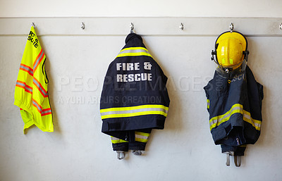 Buy stock photo Fireman's clothing hanging from a wall