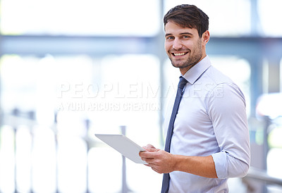 Buy stock photo Portrait of a handsome young office worker holding a digital tablet