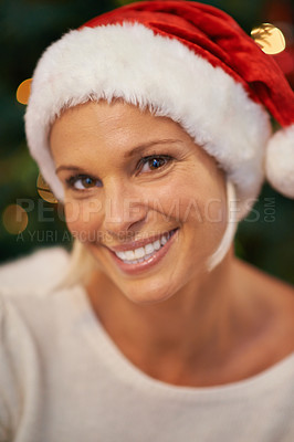Buy stock photo Woman, portrait and Christmas hat for holiday, celebration and happy for tradition at night in bokeh. Face of a person in cap for fun, excited and thanksgiving at home with selfie or profile picture