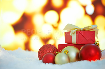 Buy stock photo An arrangement of Christmas decorations against a background of lights