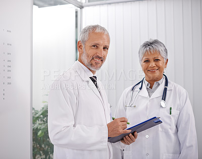 Buy stock photo Shot of two doctors working together in a hospital