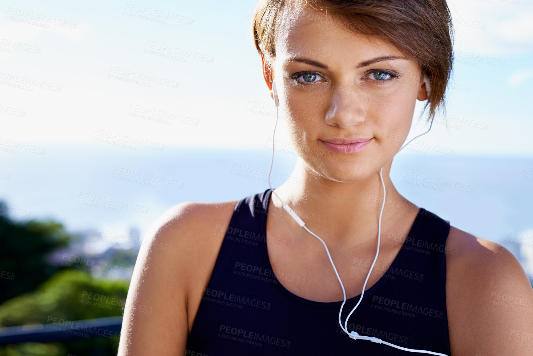 Buy stock photo Outdoor, portrait or woman ready for fitness workout, exercise or healthy wellness in nature park. Sky, listening or face of female sports person on training break with confidence, music or earphones