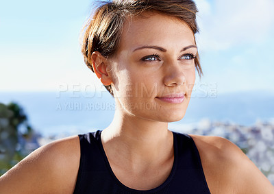 Buy stock photo Woman, happy and wellness with blue sky by ocean for fitness, training goal or thinking of exercise in nature. Athlete, active person or face with smile outdoor in summer with sportswear for workout 