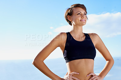 Buy stock photo A beautiful young runner standing outdoors on a sunny day