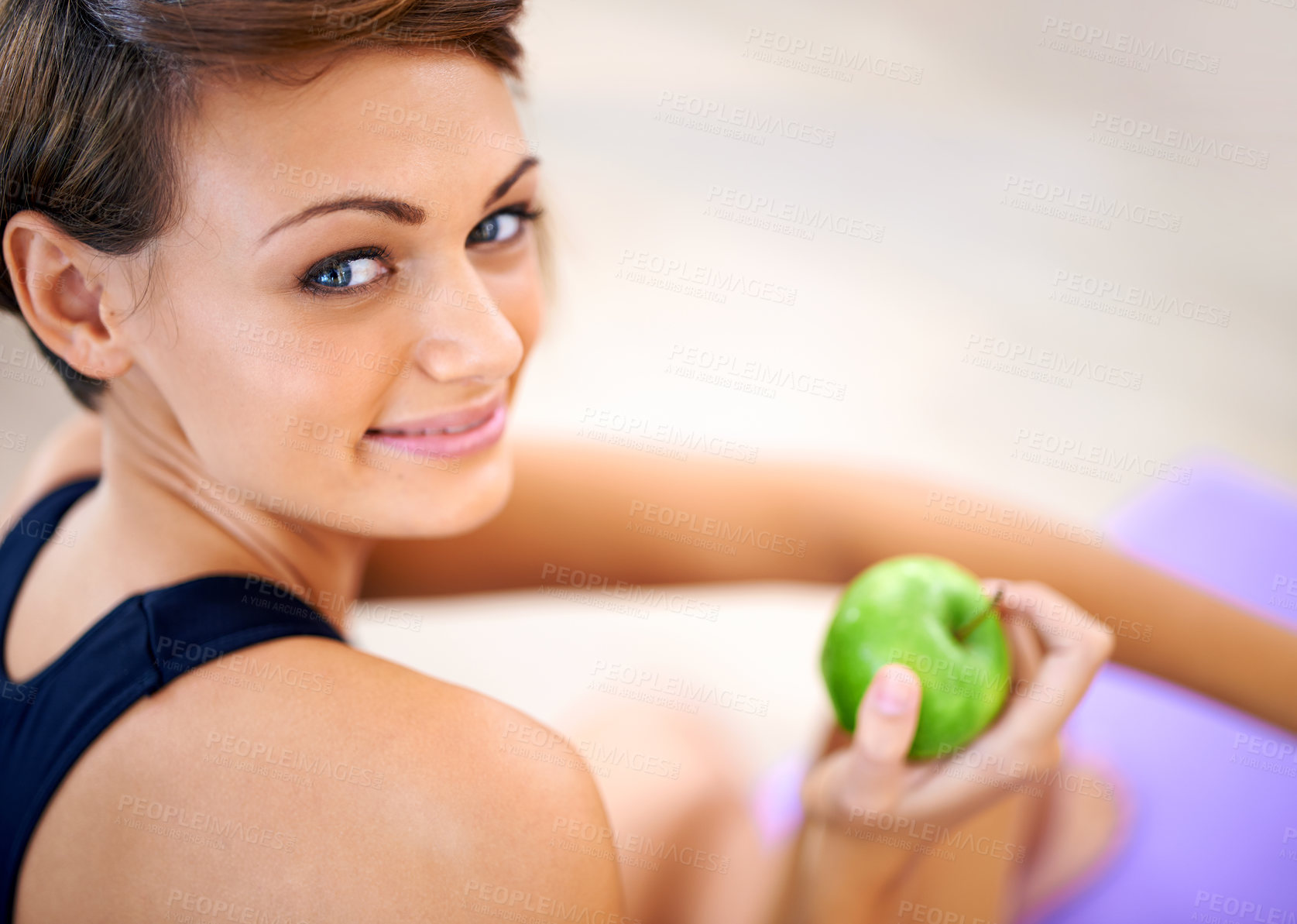 Buy stock photo Portrait, sport and happy woman with apple in gym for diet, nutrition and wellness with healthy body. Face, exercise and person with eating fruit for organic food, vitamin c or benefits  for fitness