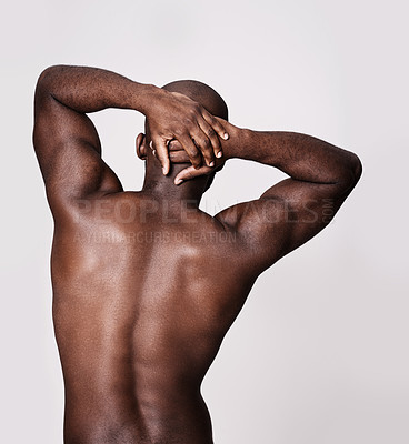 Buy stock photo Back, stretching and man in studio with health, wellness and fitness or exercise on a white background. Bodybuilder, person or model with art deco or muscle, workout and warm up for sports training