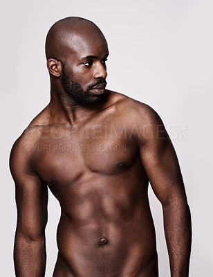 Buy stock photo Studio shot of a muscular african american man posing isolated on white