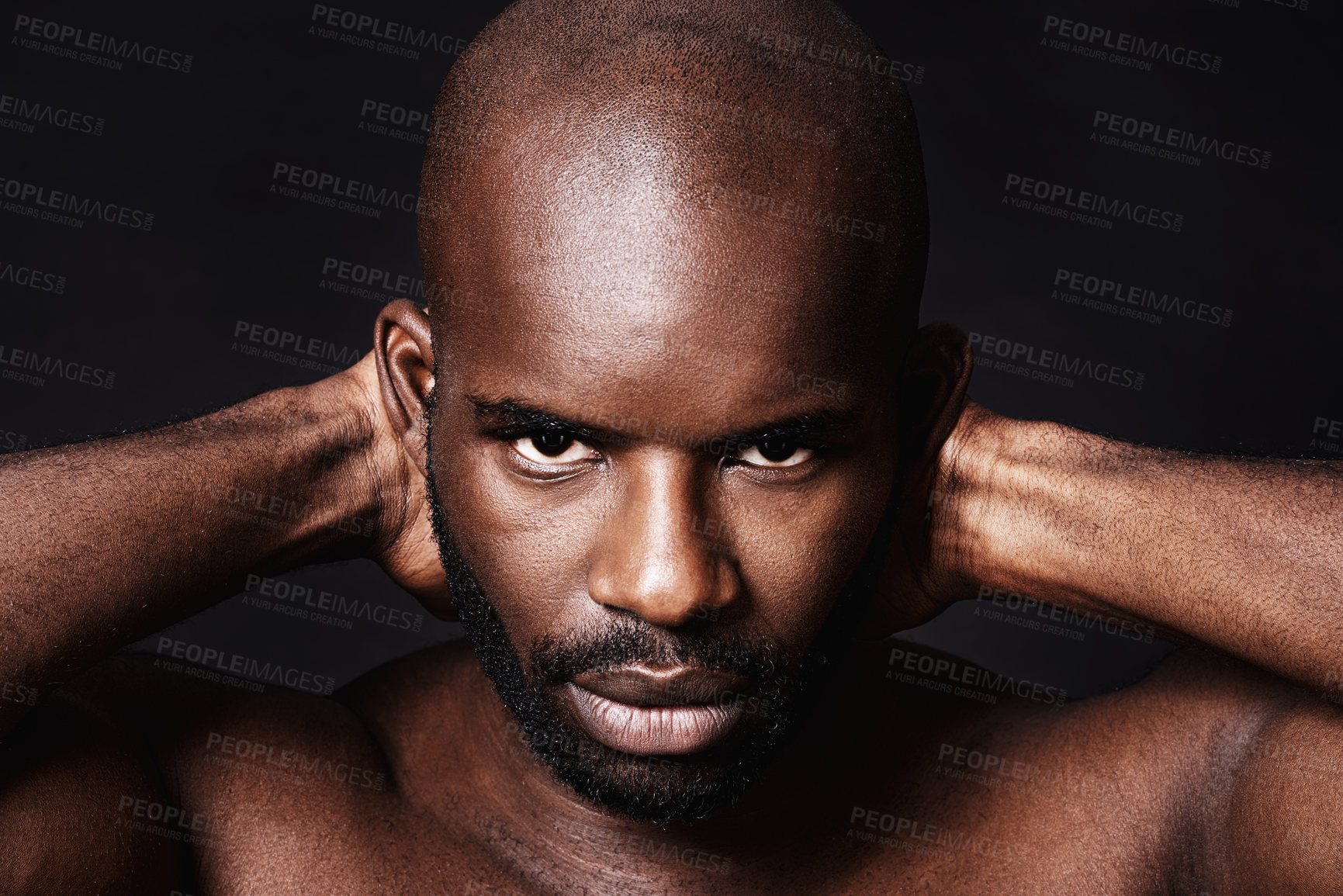 Buy stock photo Studio shot of a muscular african american man against a black background