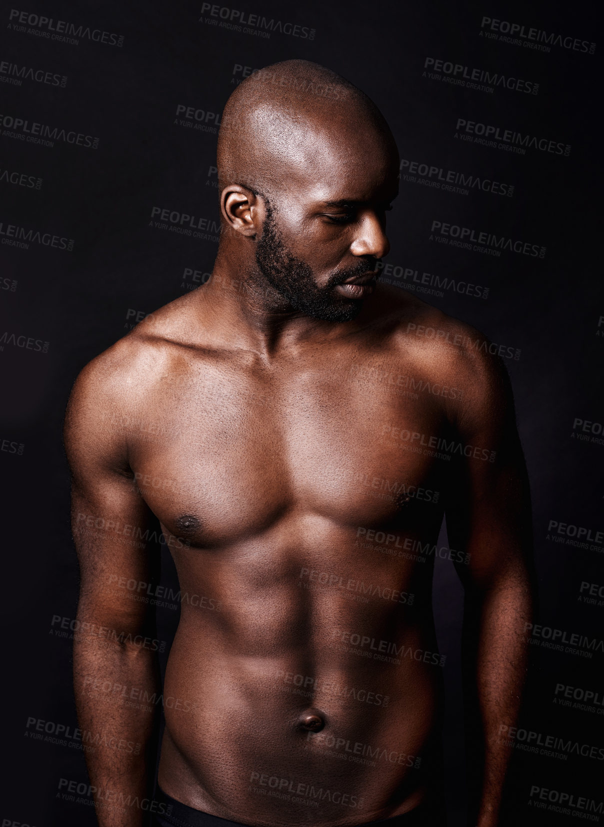 Buy stock photo Cropped shot of a shirtless muscular man isolated on black