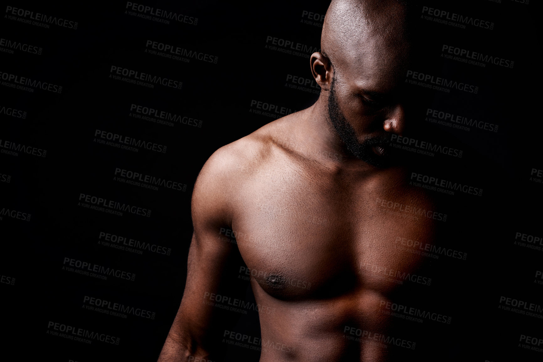 Buy stock photo Black man, muscle and fitness with shadow for exercise or workout on a dark studio background. Closeup of young African male person or bodybuilder with masculine or muscular body on mockup space