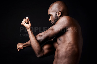 Buy stock photo Black man, fitness and stretching arms with muscle in workout, exercise or training on a dark studio background. Muscular African, male person or bodybuilder in body warm up or health on mockup space