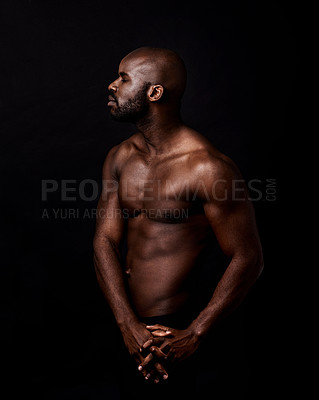 Buy stock photo Black man, body and fitness on a dark background for dermatology and shadow or light with art deco or aesthetic. Bodybuilder, model or young person thinking in studio with shirtless abs and beauty