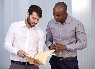 Buy stock photo Cropped shot of two businessmen the budget