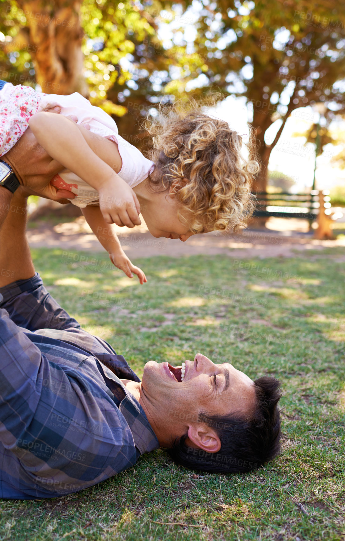 Buy stock photo Plane, father and daughter with playing in park on grass for fun game, bonding and healthy relationship with energy. Happy family, man or girl child with airplane, childhood fantasy or flying outdoor