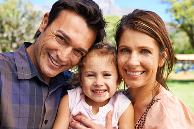 Buy stock photo Happy family, parents and portrait with child in park for bonding, healthy relationship and relax on Saturday. Smile, father and mother with daughter for selfie in nature, dad and mom with young girl