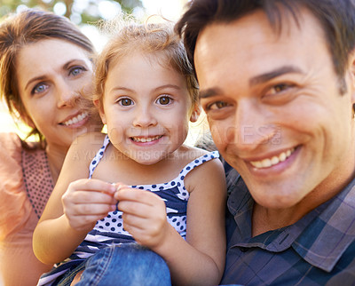 Buy stock photo Family, parents and portrait with child in park happy for bonding, healthy relationship and relax on Saturday. Smile, father and mother with daughter for selfie in nature, dad and mom with young girl
