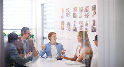 Buy stock photo Shot a team of colleagues having an office meeting