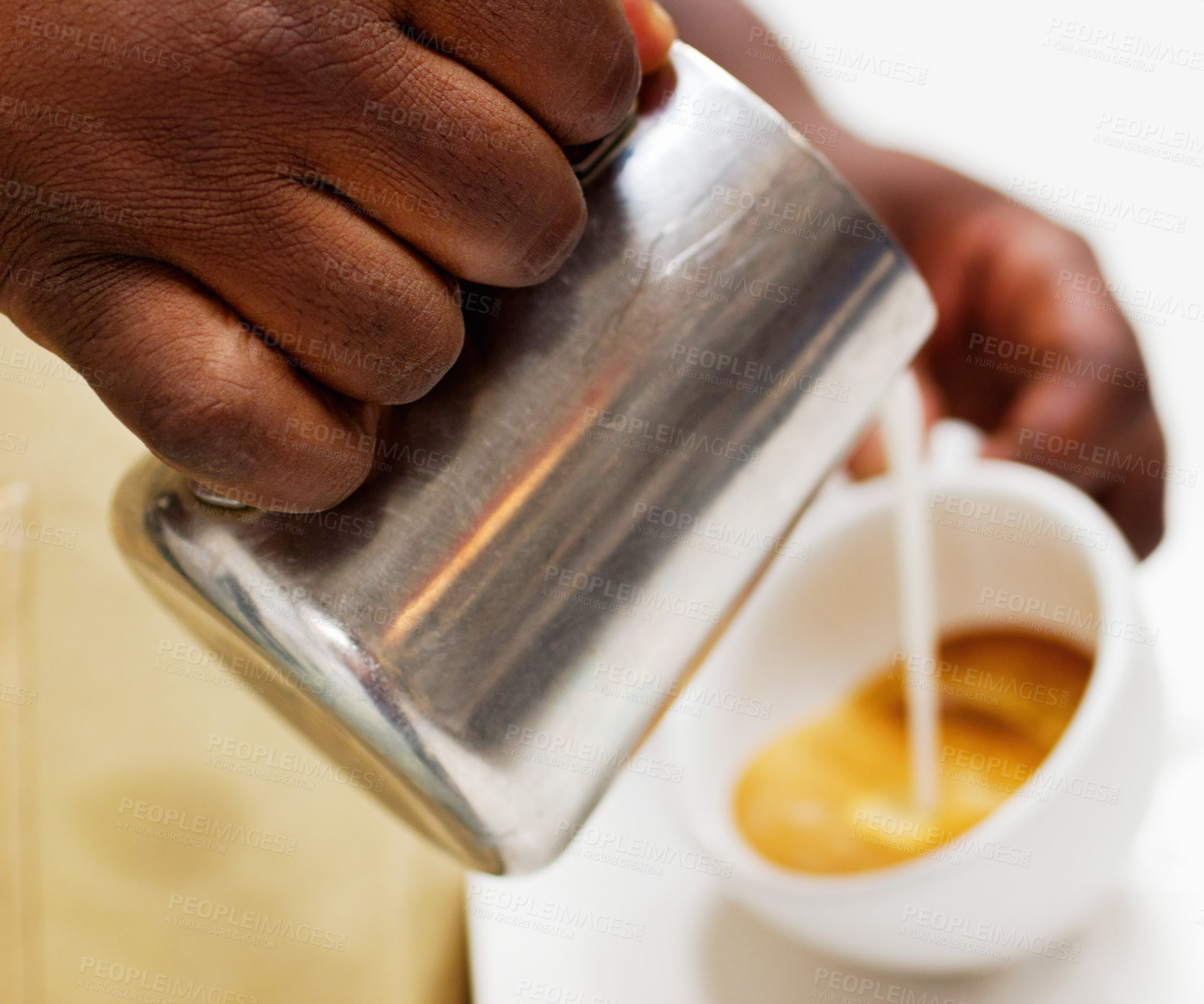 Buy stock photo Hands, coffee and a barista pouring milk into a cup while working in a cafe for hospitality or service. Kitchen, beverage and caffeine with a waitress in a restaurant to prepare a drink closeup