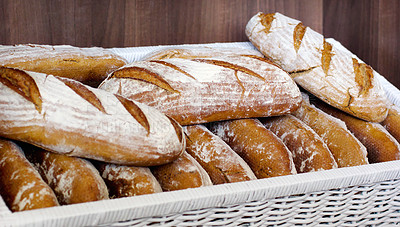 Buy stock photo Bread in a basket, bakery presentation and food with baked goods, wheat product in store and catering. Baguette, hospitality industry with cafe or patisserie in France, nutrition and cuisine