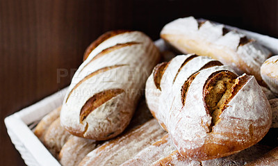 Buy stock photo Closeup of a pile of freshly-baked bread loaves