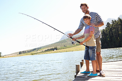 Buy stock photo Father, child and fishing in a nature portrait for learning, teaching and outdoor with holiday, travel or sustainable living. Happy family, dad and boy or kid with rod by water or lake for camping