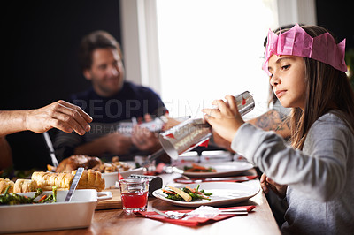 Buy stock photo Shot of a family opening their Christmas crackers