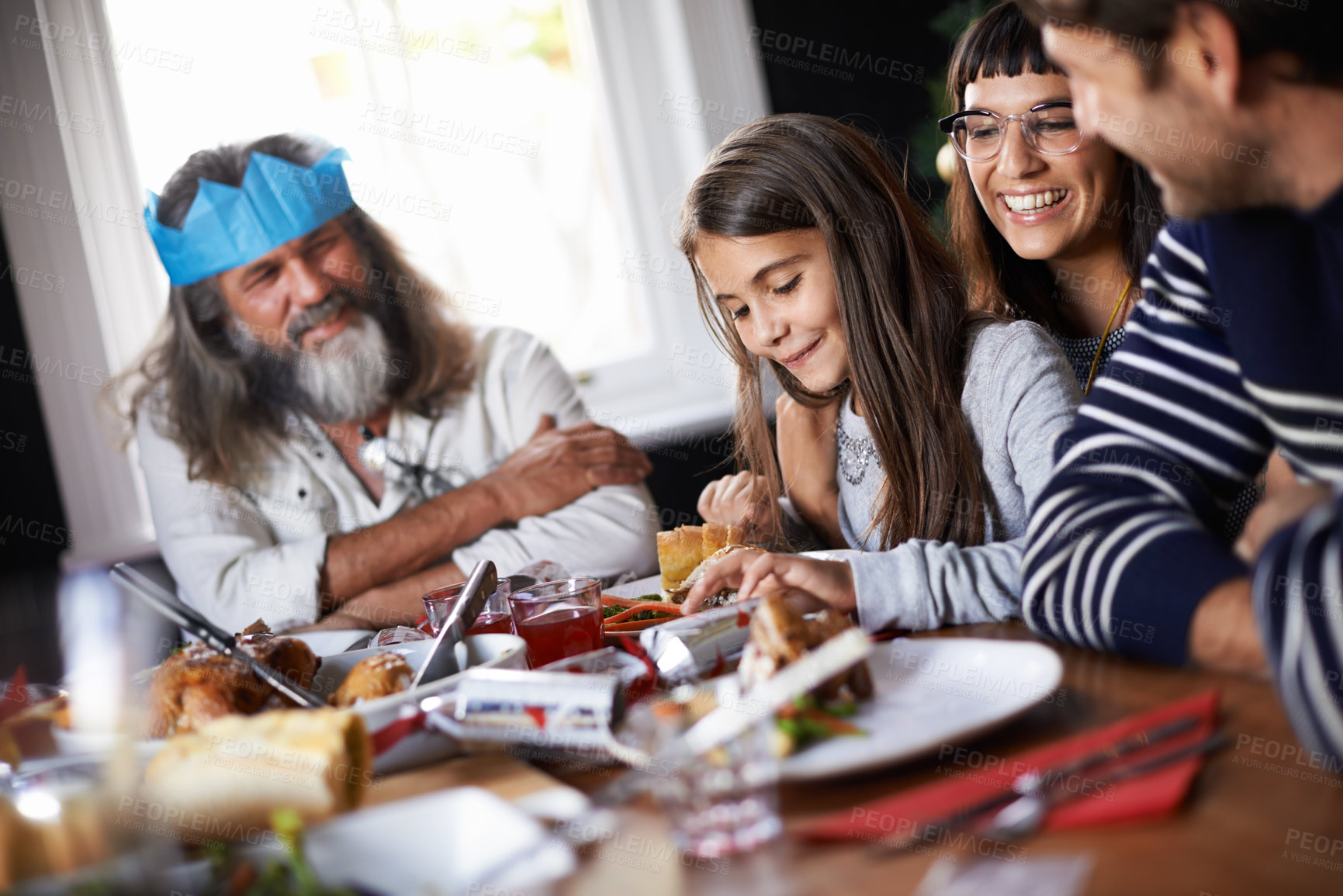 Buy stock photo Christmas, celebration and family with child in home for dinner, lunch and eating together for festival. Mother, father and girl with food for holiday, vacation and festive party at dining table
