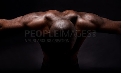 Buy stock photo Studio shot of a muscular african american man leaning forward