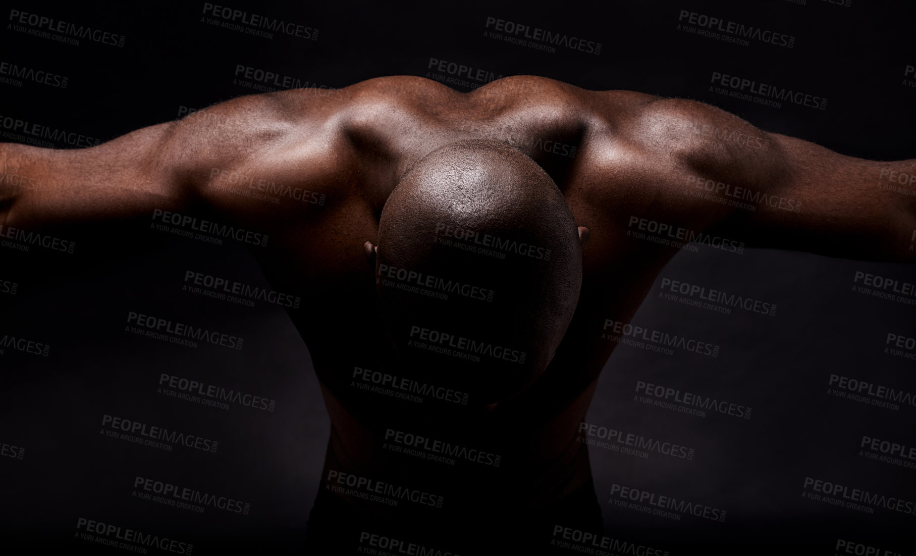 Buy stock photo Studio shot of a muscular african american man leaning forward