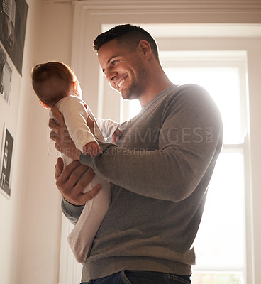 Buy stock photo Father, baby and bonding with happiness and love, growth and child development with joy at family home. Man, infant or newborn with smile and dad holding kid for comfort, childhood and parenting 
